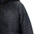 General detail shot of chest zipper pocket and logo patch on Topo Designs Women's Global Puffer recycled insulated packable Hoodie jacket in "black"
