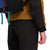 Back model shot of Topo Designs women's boulder lightweight hiking and climbing pants in "black" showing logo patch on back pocket.