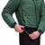 General front model shot of Topo Designs Women's Puffer recycled insulated Jacket in "Forest" green showing adjustable cinch cord in waist