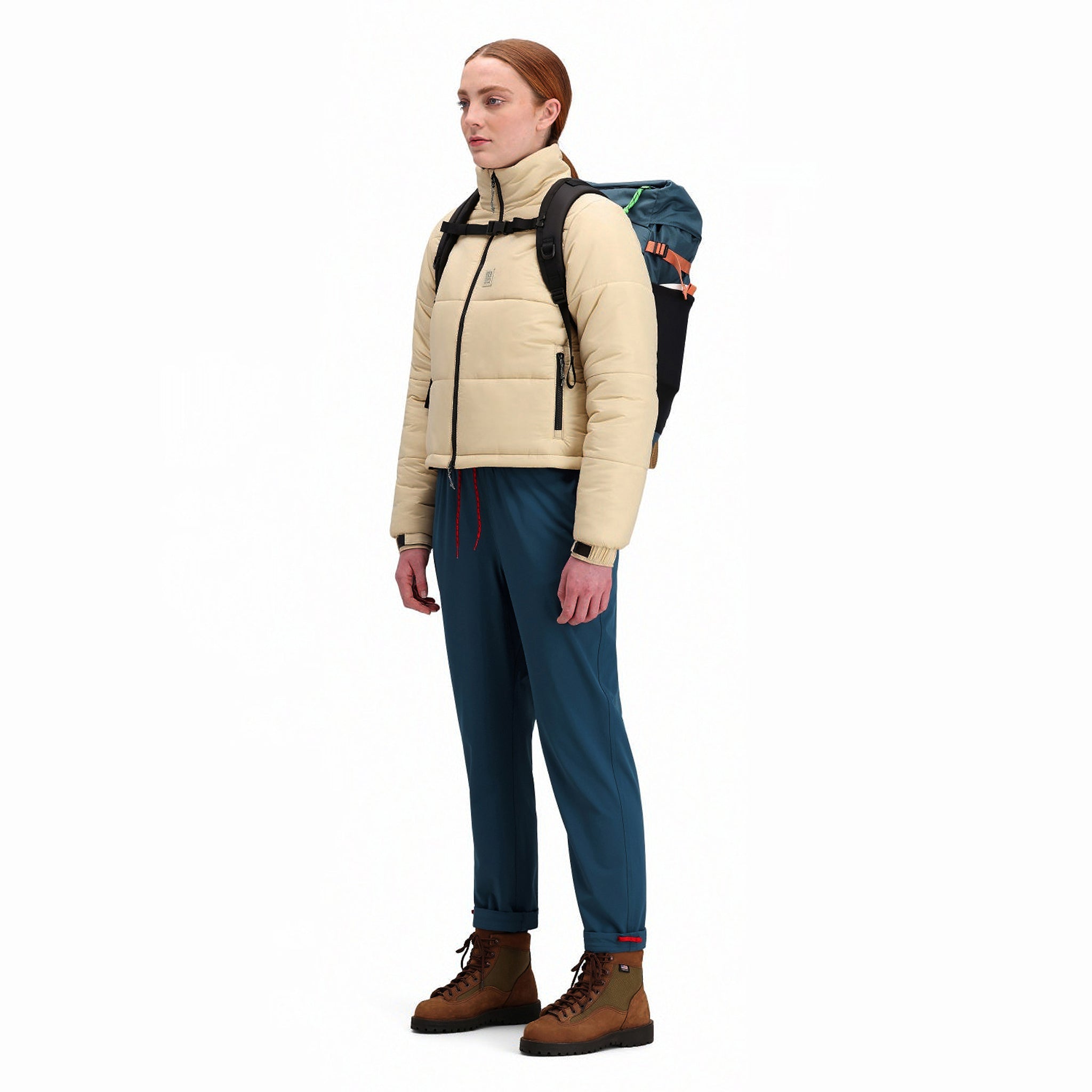 Front model shot of Topo Designs Women's Puffer recycled insulated Jacket in "Sand" white.