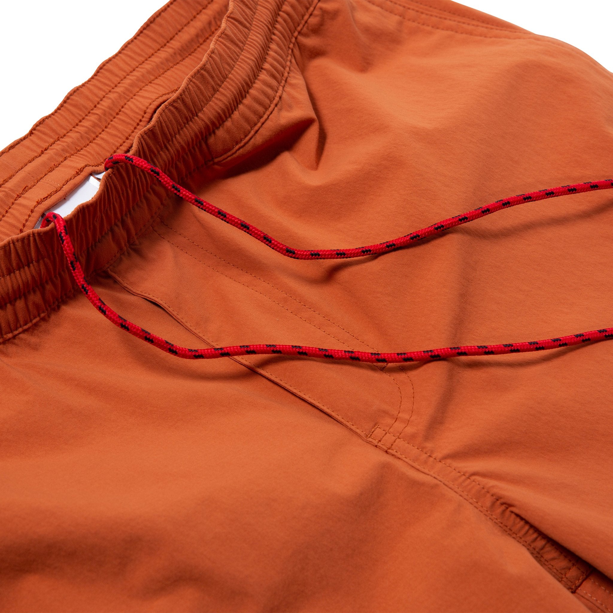 Detail shot of Topo Designs Men's Global Shorts in Clay showing elastic waist with drawstring