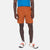 Close-up front model shot of Topo Designs Men's Global Shorts in Brick orange.