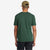 Back of Topo Designs Men's Reflecting Peaks short sleeve graphic t-shirt in 100% organic cotton forest green on model.