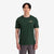 General shot on-model front view of Topo Designs Men's Alpenglow Tee 100% organic cotton graphic short sleeve t-shirt in "forest" green.