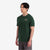 General shot on model side view of Topo Designs Men's Alpenglow Tee 100% organic cotton graphic short sleeve t-shirt in "forest" green.