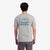 On model back view Topo Designs Men's Geographic Tee 100% organic cotton short sleeve graphic logo t-shirt in "gray".