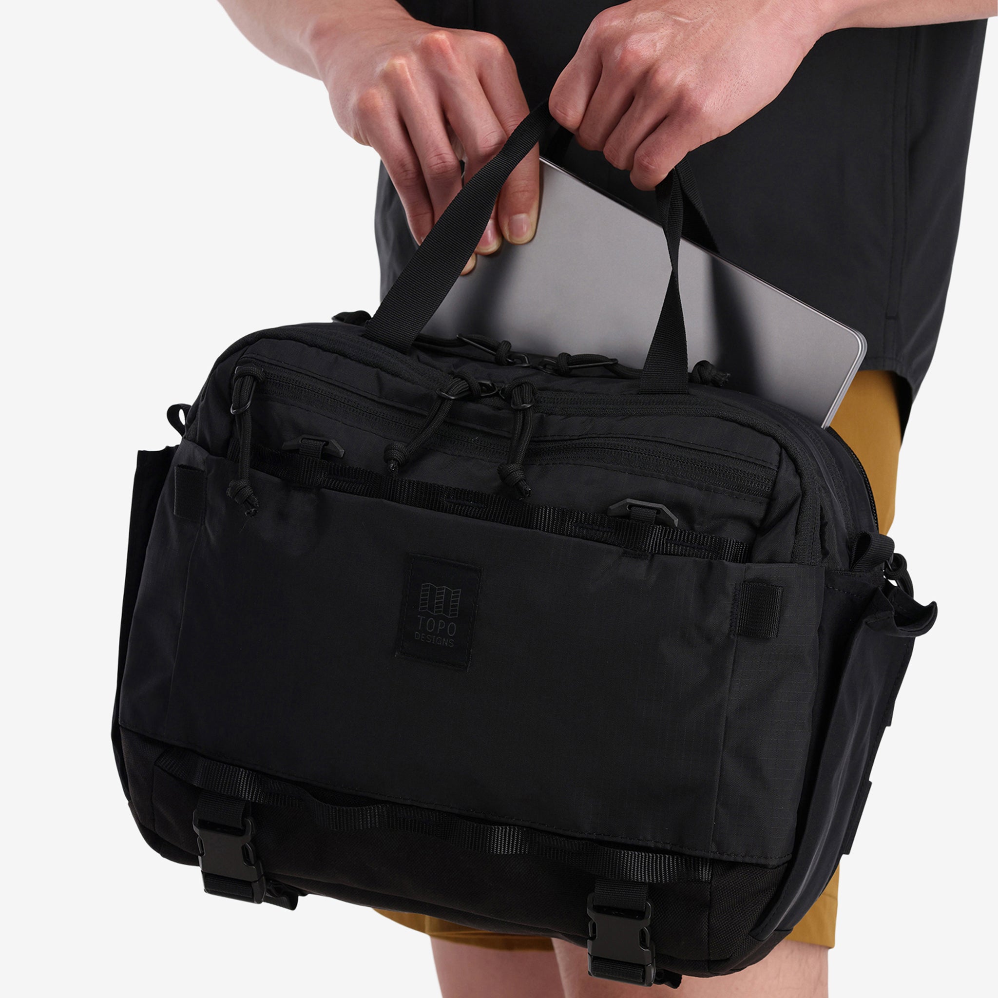 Laptop sleeve view of Topo Designs Mountain Cross Bag in recycled "Black" nylon.