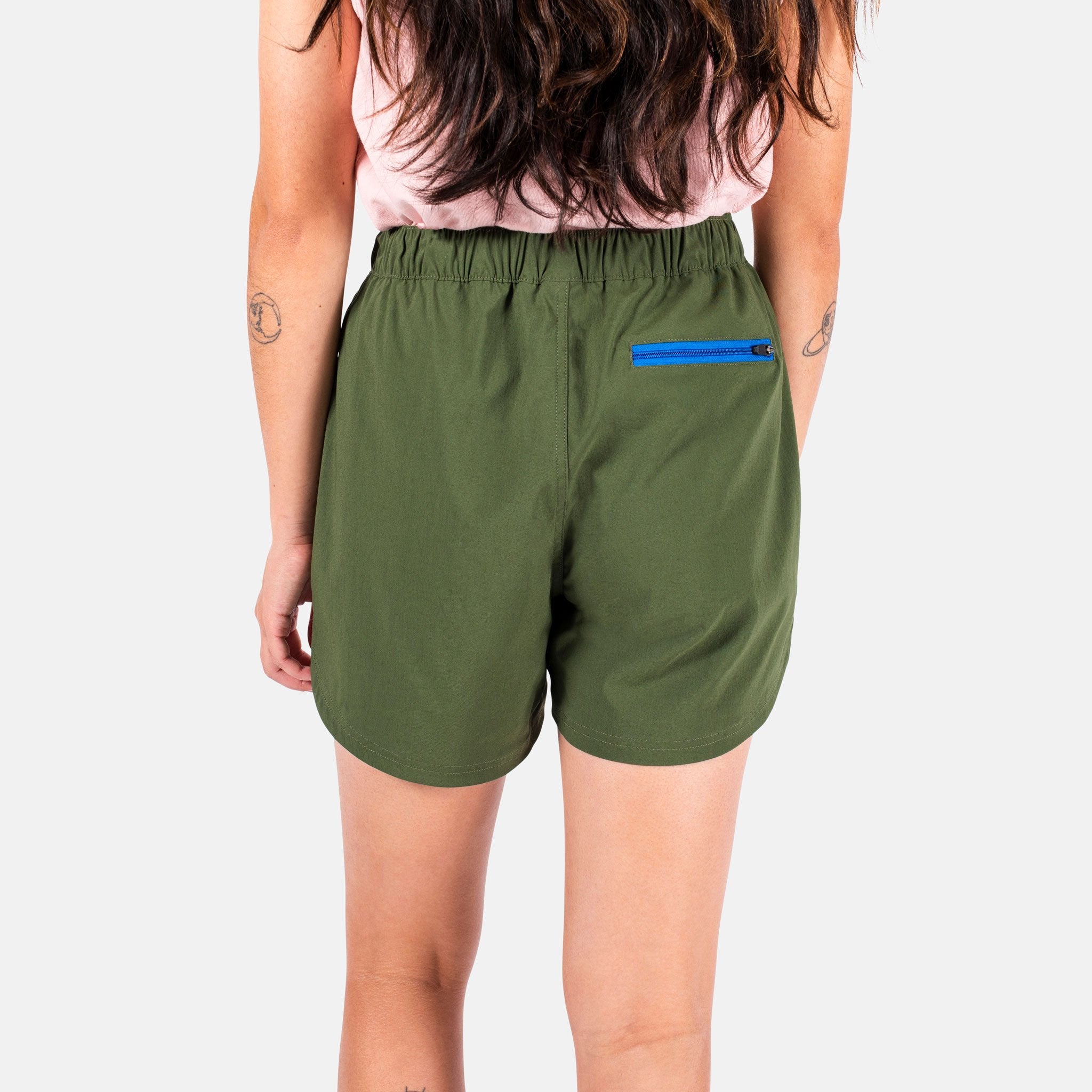 General close-up back model shot of Topo Designs Women's River Shorts in olive green.