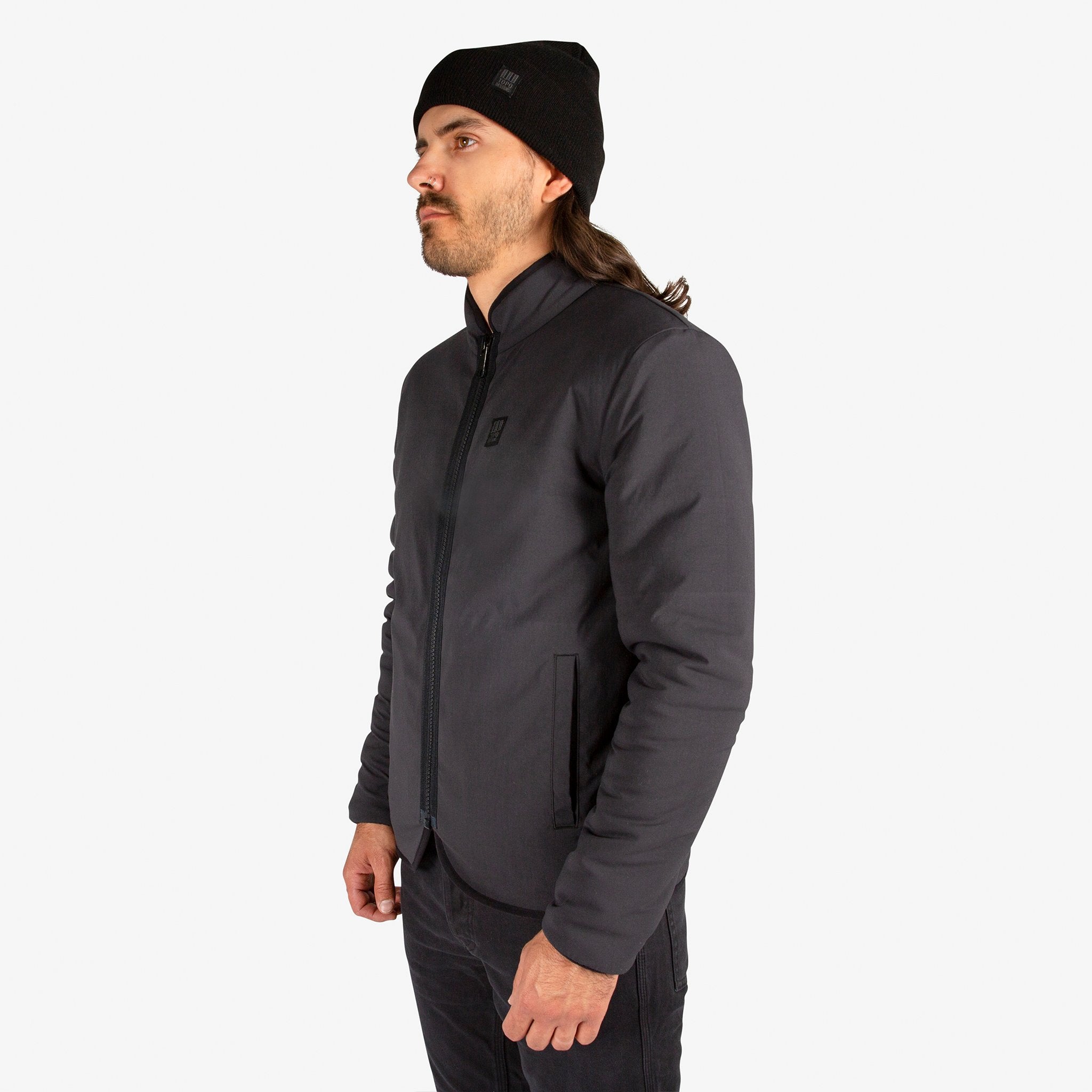 General close-up side model shot of Topo Designs Men's Sherpa Jacket in Black showing DWR side.