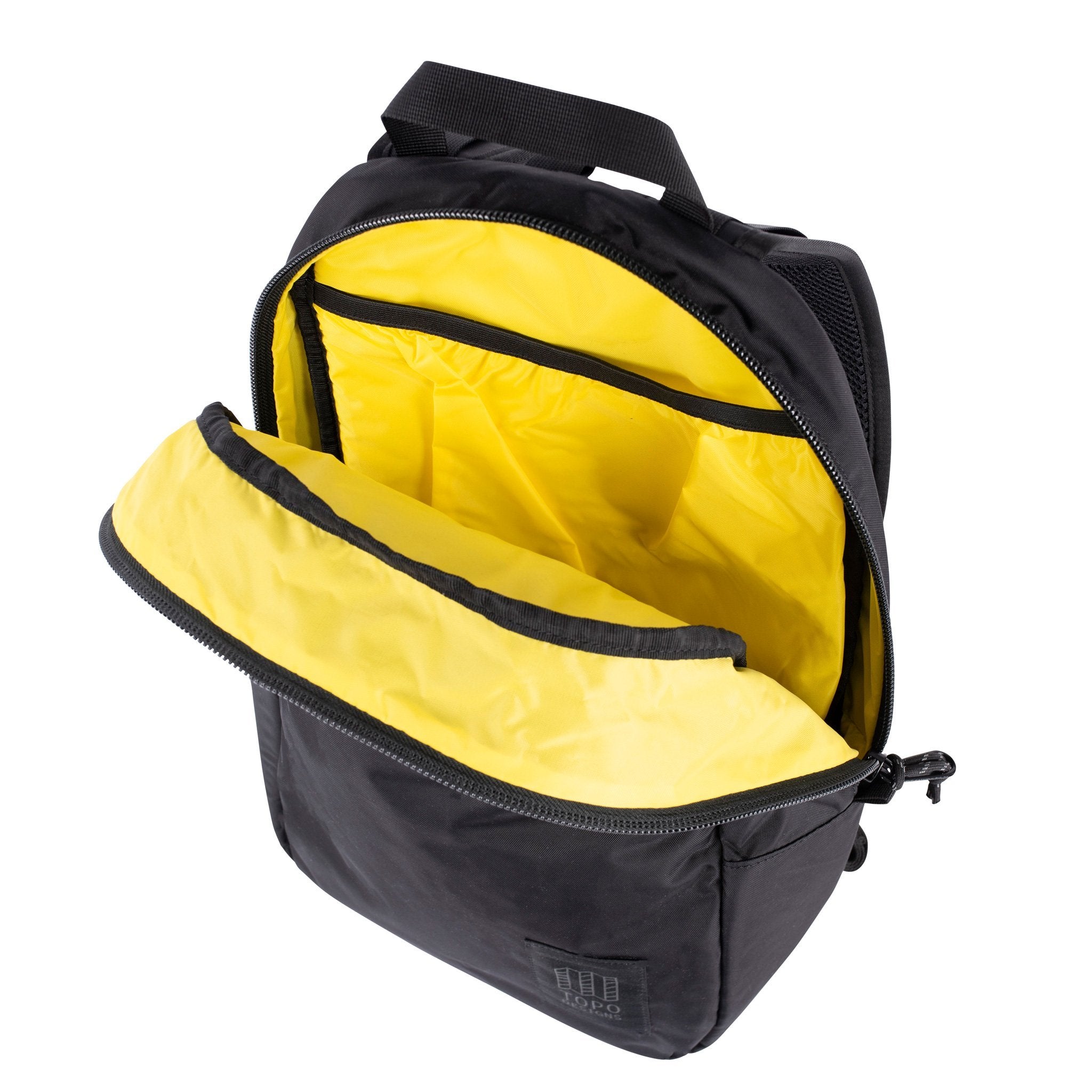 Detail product shot of Light Pack in Black/Black showing yellow lining and laptop sleeve.