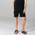 Front model shot of Topo Designs Men's Mountain Shorts in Black.