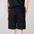 Back model shot of Topo Designs Men's Mountain Shorts in Black.