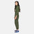 Side model shot of the Topo Designs Women's Coverall jumpsuit in Olive green