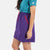 Close-up side model shot of Topo Designs Women's Sport Skirt in Purple