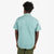 Topo Designs Men's Short Sleeve Dirt Shirt in Sage green on model showing back.