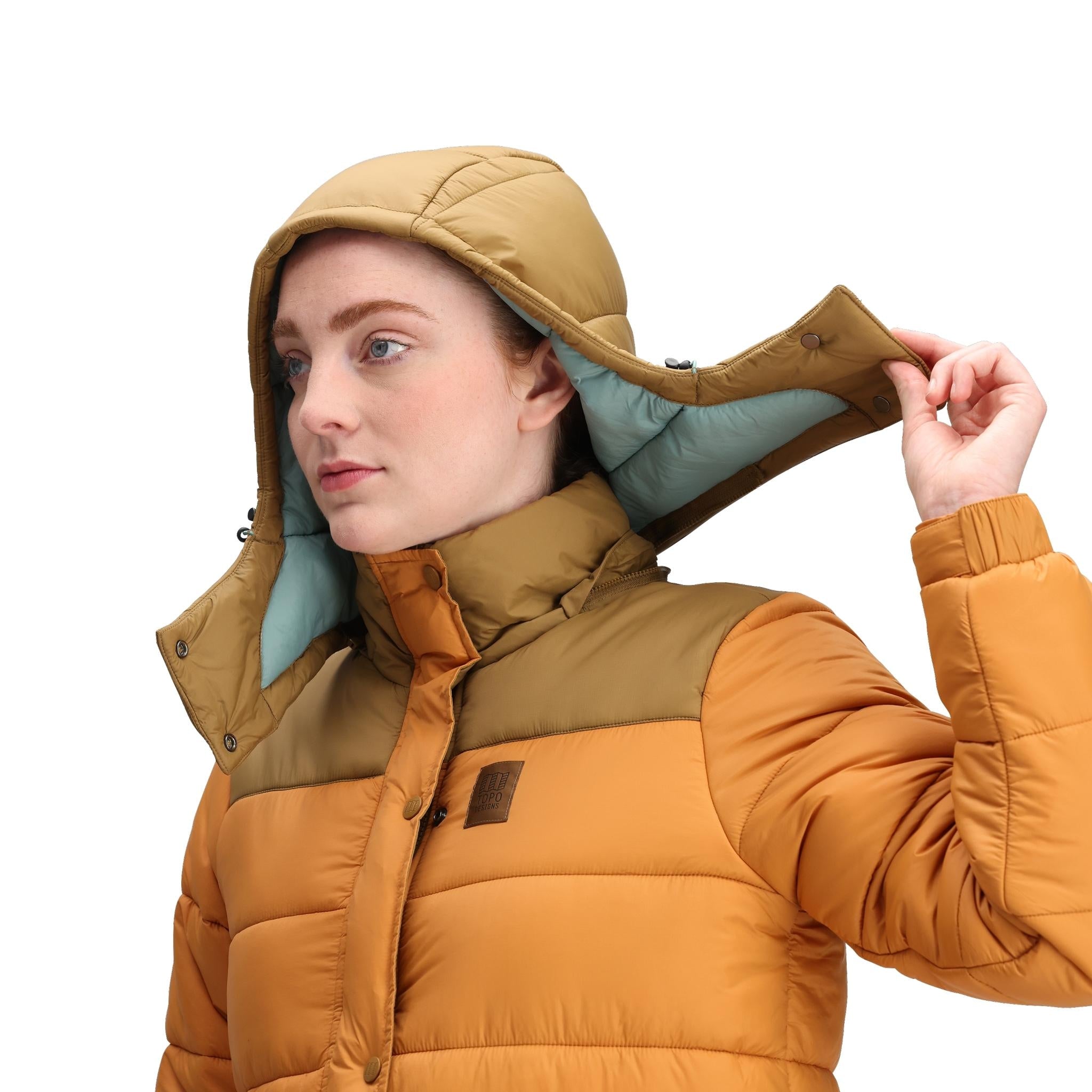 Detailaufnahme von Topo Designs Retro Ridge Puffer Jacket - Damen  in "Dark Khaki / Spice"